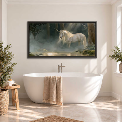 A white unicorn standing near rocks and a quiet stream in a green woodland single framed canvas wall art styled in an interior