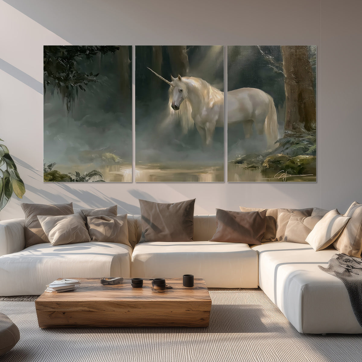A white unicorn standing near rocks and a quiet stream in a green woodland set of 3 poster prints displayed in a living room