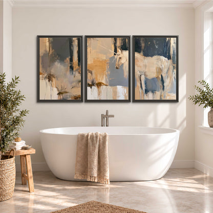 A pale unicorn emerging from loose vertical strokes of blue, ochre and cream 3 piece framed canvas wall art styled in an interior