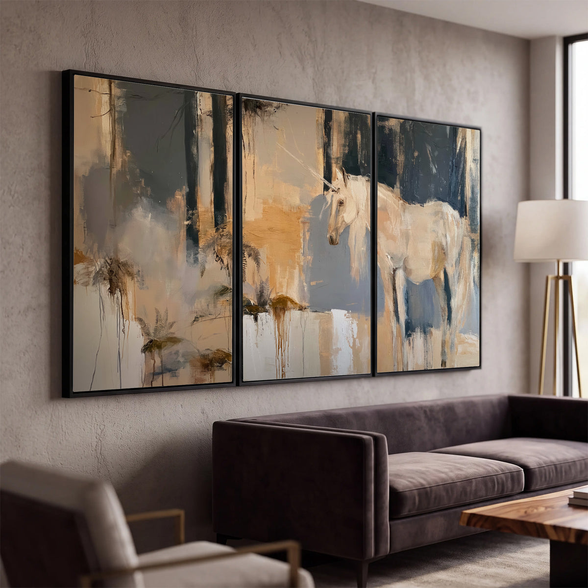A pale unicorn emerging from loose vertical strokes of blue, ochre and cream 3 piece framed canvas wall art displayed in a modern living room