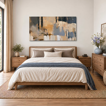 A pale unicorn emerging from loose vertical strokes of blue, ochre and cream single canvas wall art styled in an interior