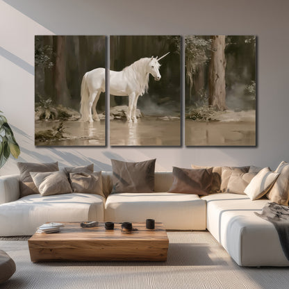 A white unicorn standing beside shallow water beneath tall shadowed trees 3 piece canvas wall art displayed in a living room