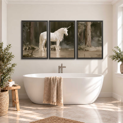 A white unicorn standing beside shallow water beneath tall shadowed trees 3 piece framed canvas wall art styled in an interior