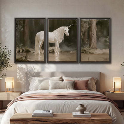 A white unicorn standing beside shallow water beneath tall shadowed trees 3 piece framed canvas wall art displayed in a bedroom