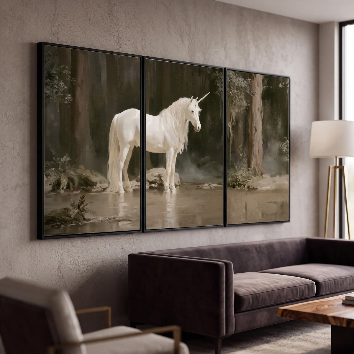 A white unicorn standing beside shallow water beneath tall shadowed trees 3 piece framed canvas wall art displayed in a modern living room