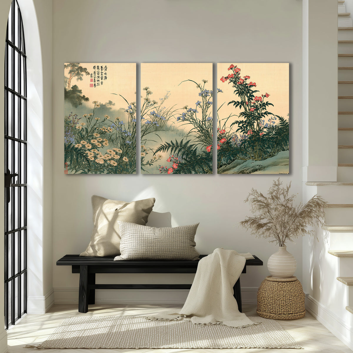 Delicate wildflowers and ferns arranged on a warm neutral ground with decorative script 3 piece canvas wall art displayed in a entryway