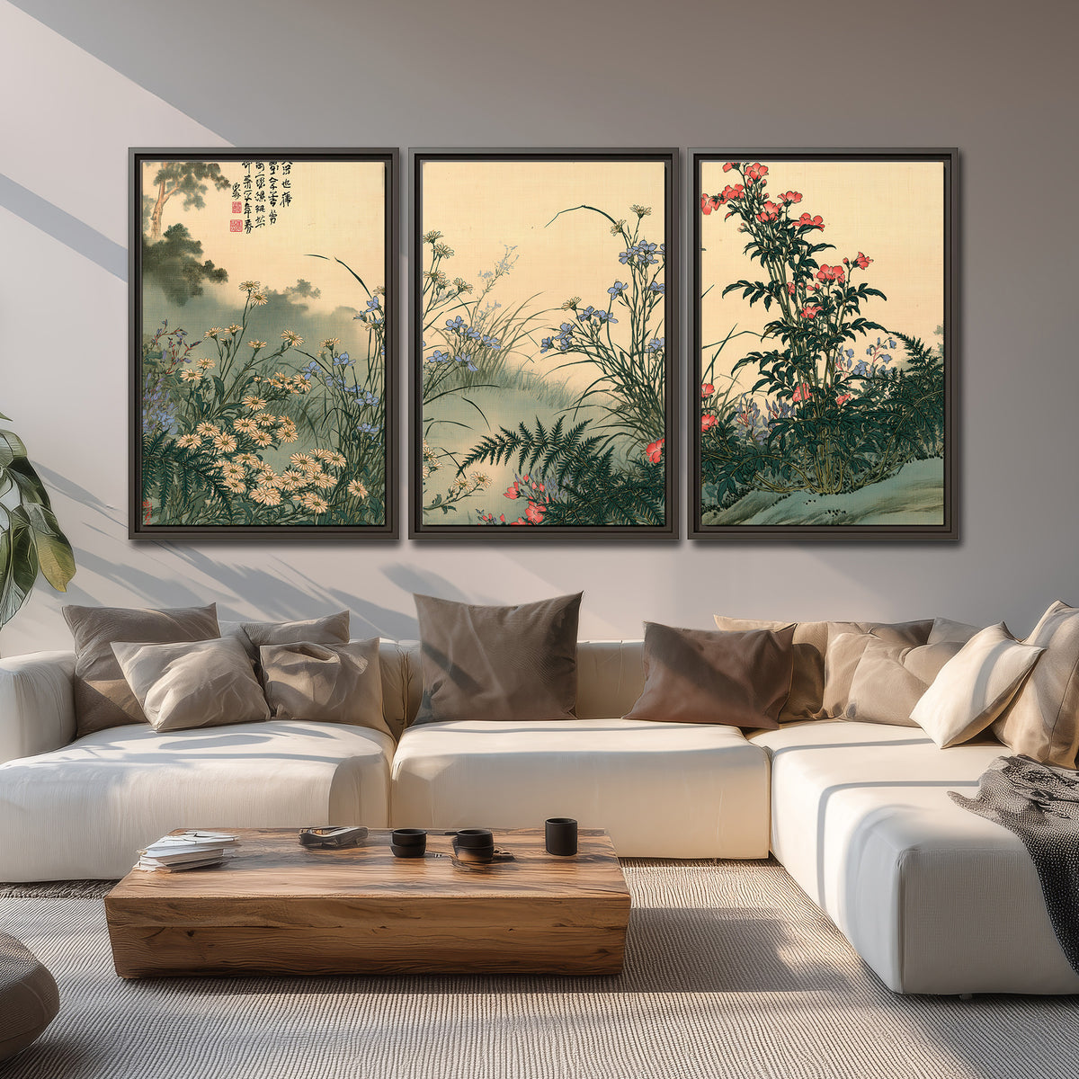 Delicate wildflowers and ferns arranged on a warm neutral ground with decorative script 3 piece framed canvas wall art displayed in a living room