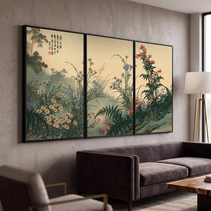 Delicate wildflowers and ferns arranged on a warm neutral ground with decorative script 3 piece framed canvas wall art displayed in a modern living room