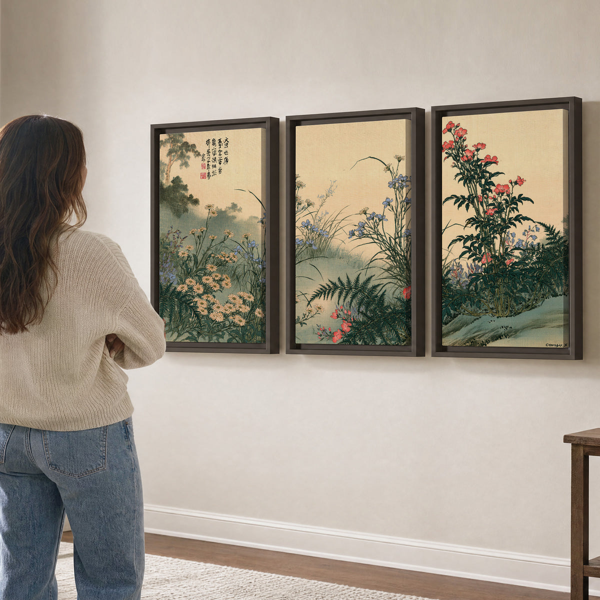 Delicate wildflowers and ferns arranged on a warm neutral ground with decorative script 3 piece framed canvas wall art three panel arrangement on a wall