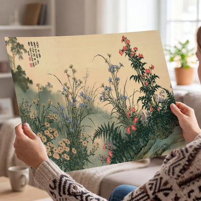 Delicate wildflowers and ferns arranged on a warm neutral ground with decorative script single poster print held in hands