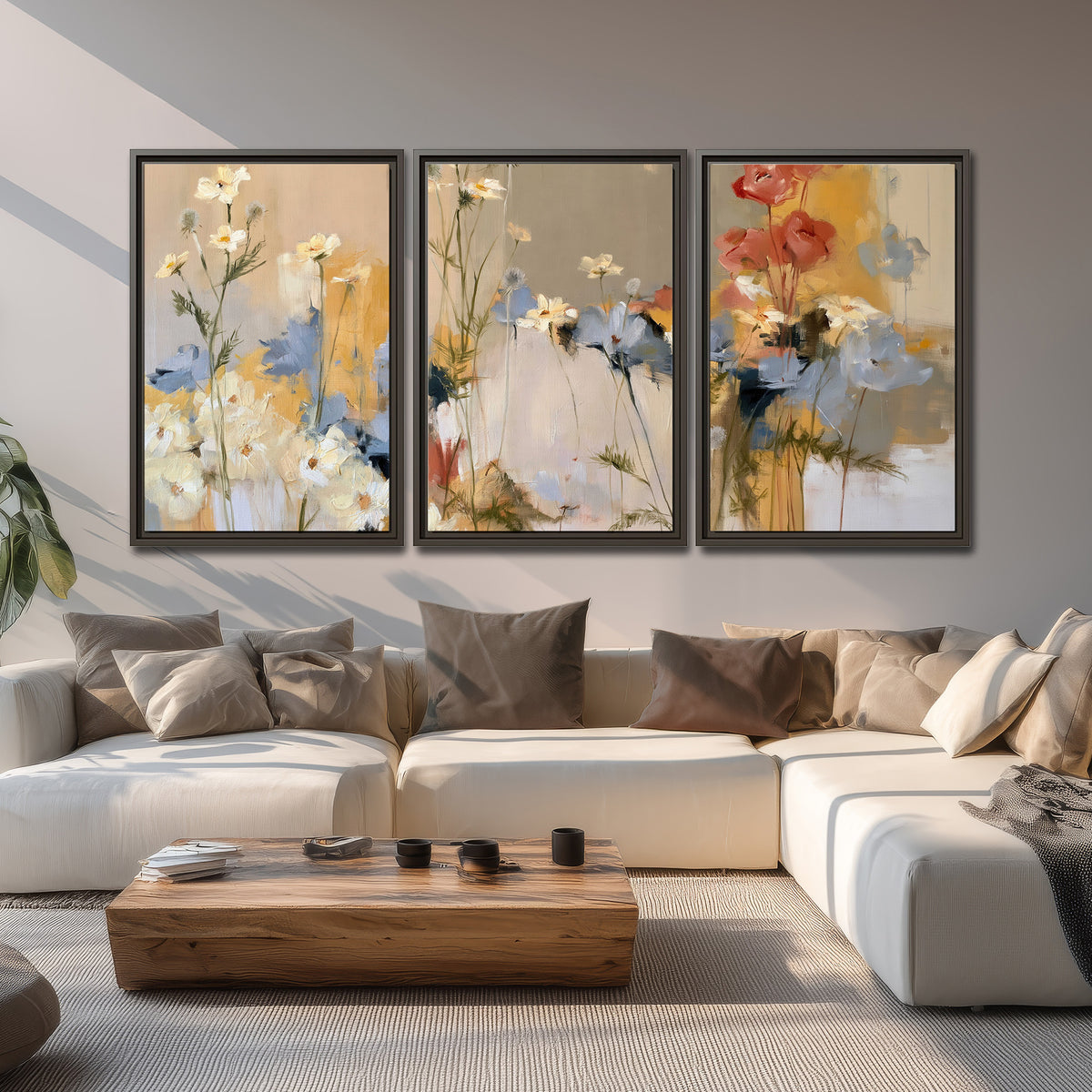 Loose white and yellow flowers set against vertical blue and golden strokes 3 piece framed canvas wall art displayed in a living room