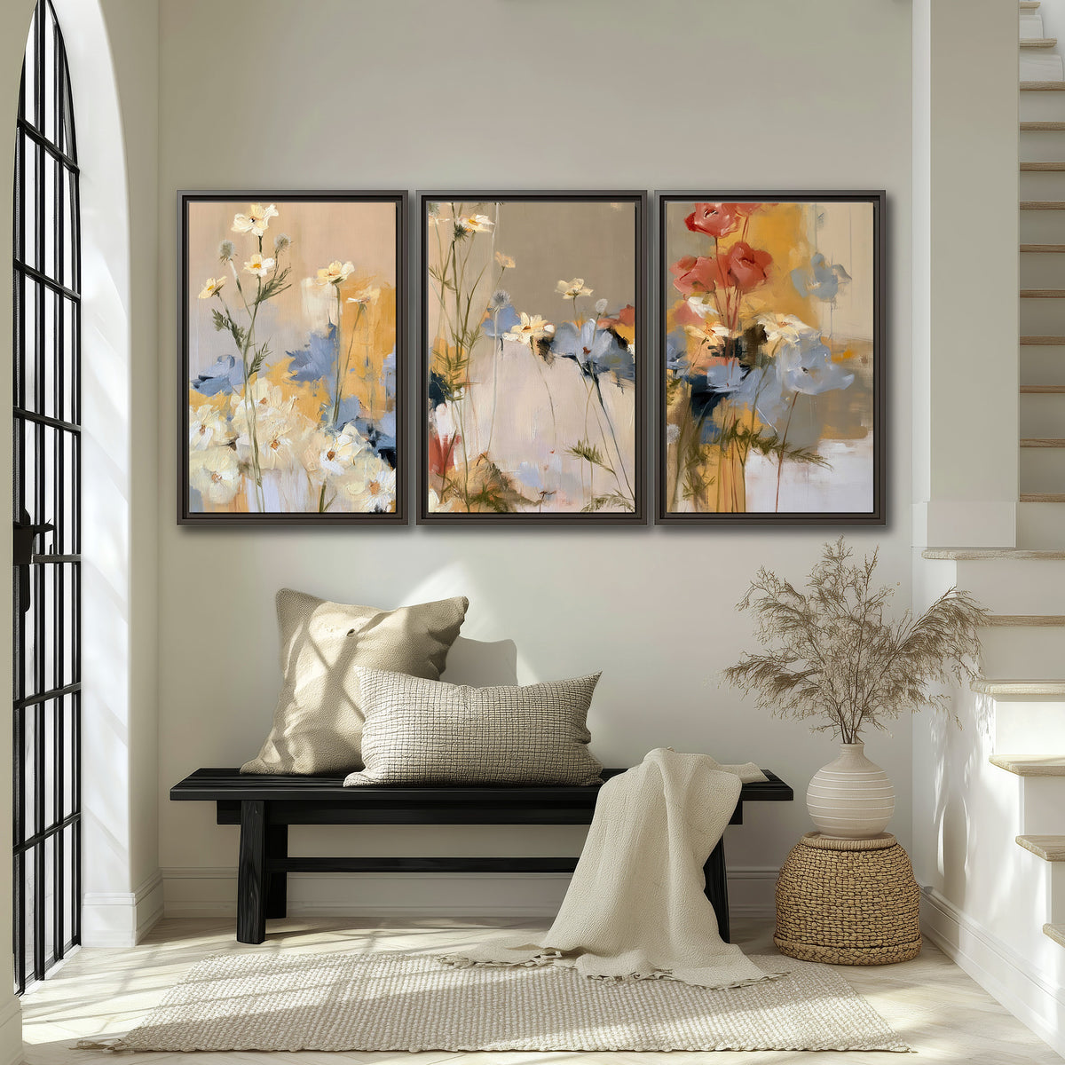 Loose white and yellow flowers set against vertical blue and golden strokes 3 piece framed canvas wall art displayed in a entryway