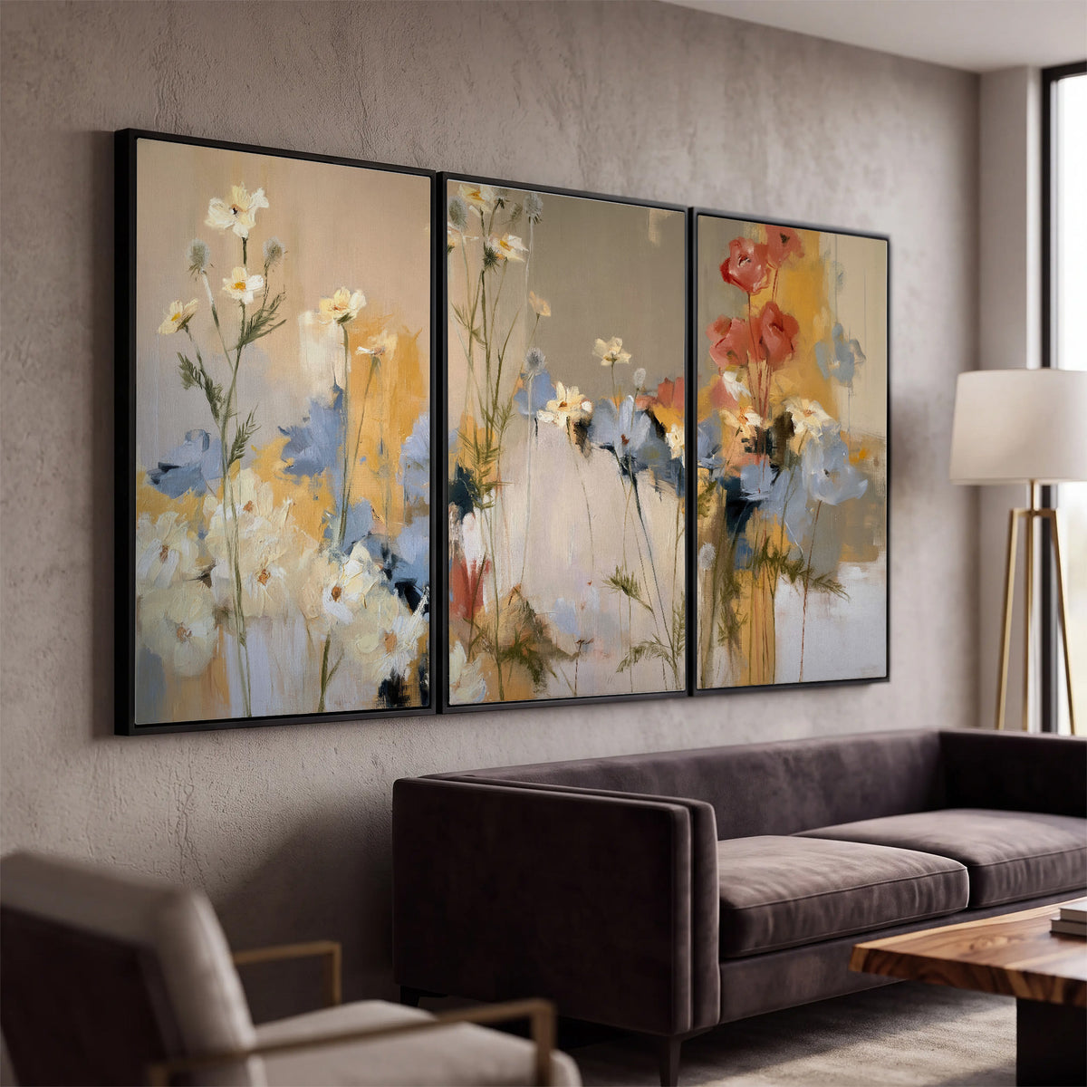 Loose white and yellow flowers set against vertical blue and golden strokes 3 piece framed canvas wall art displayed in a modern living room