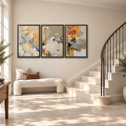 Loose white and yellow flowers set against vertical blue and golden strokes 3 piece framed canvas wall art styled in an interior