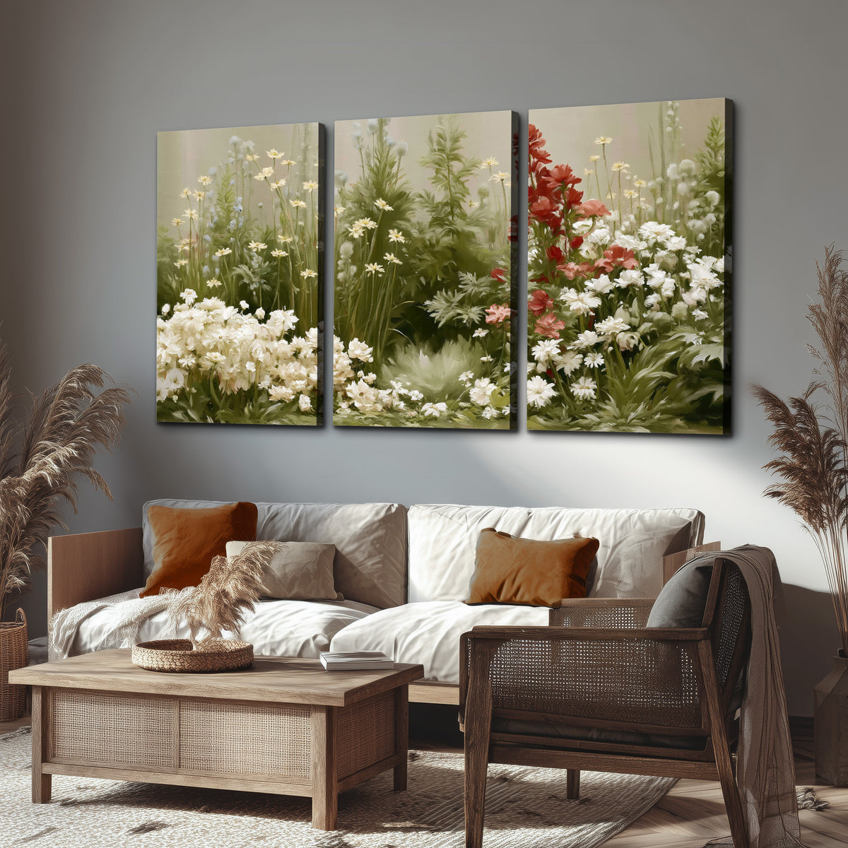 A soft meadow of white daisies and tall red blooms against a green background 3 piece canvas wall art displayed in a rustic living room