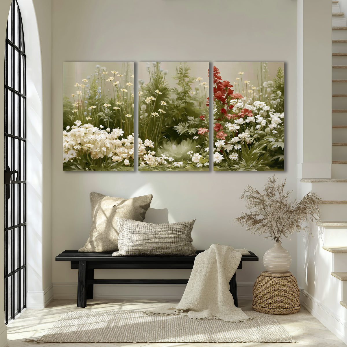 A soft meadow of white daisies and tall red blooms against a green background 3 piece canvas wall art displayed in a entryway
