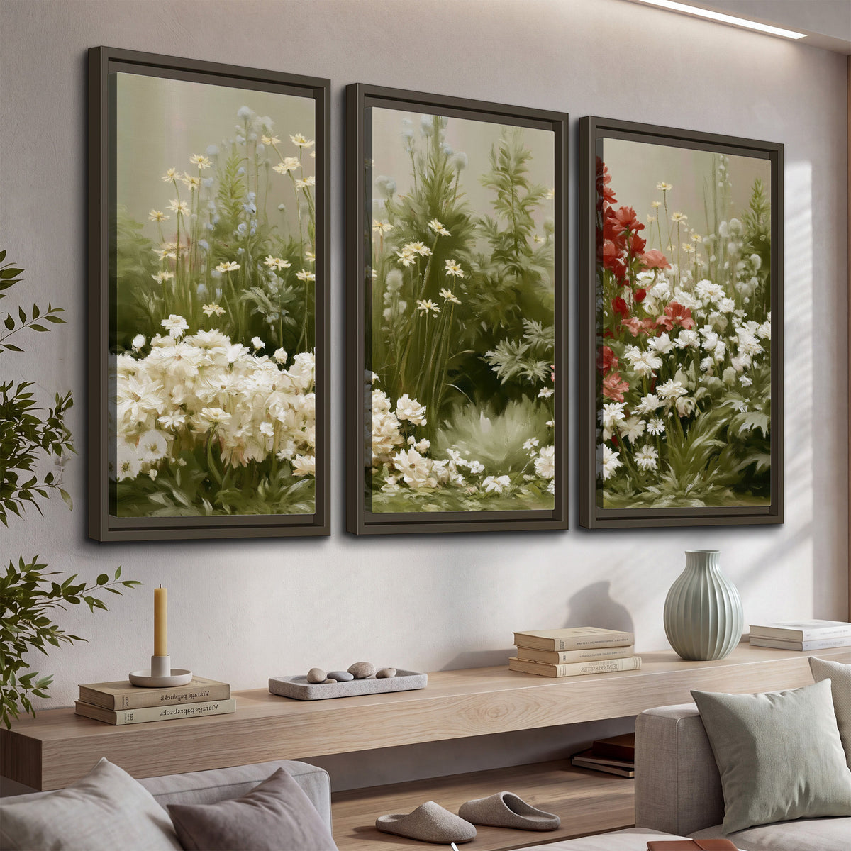 A soft meadow of white daisies and tall red blooms against a green background 3 piece framed canvas wall art displayed in a console