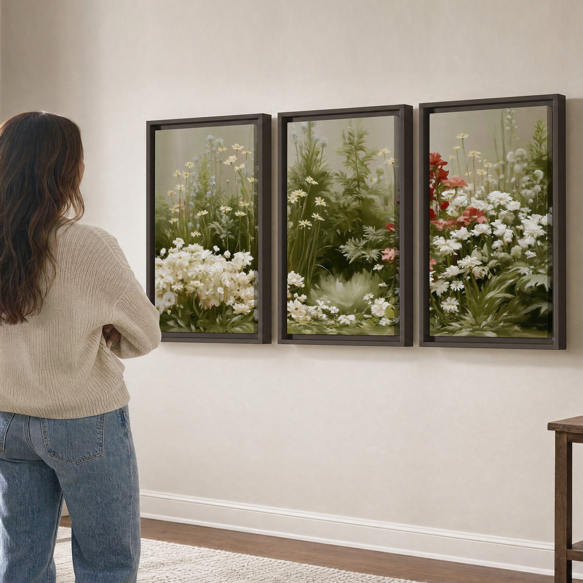 A soft meadow of white daisies and tall red blooms against a green background 3 piece framed canvas wall art three panel arrangement on a wall