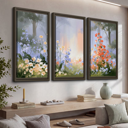 Colorful white, blue and orange flowers beneath a warm shaft of woodland light 3 piece framed canvas wall art displayed in a console