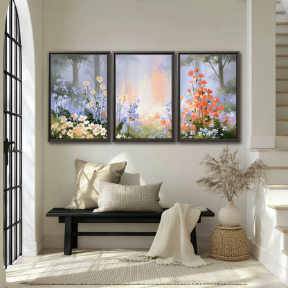 Colorful white, blue and orange flowers beneath a warm shaft of woodland light 3 piece framed canvas wall art displayed in a entryway