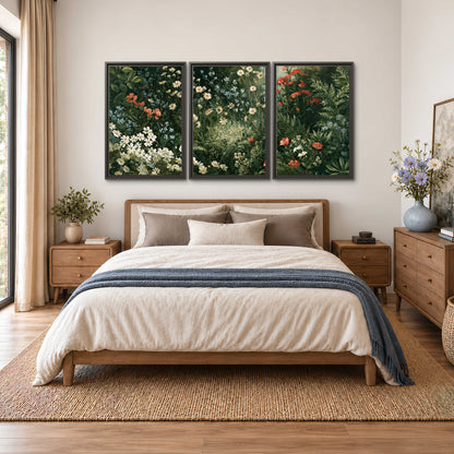 Small white flowers and red blossoms among deep green woodland leaves 3 piece framed canvas wall art styled in an interior