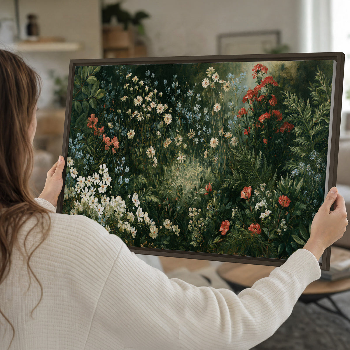 Small white flowers and red blossoms among deep green woodland leaves single framed canvas wall art held in hands