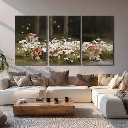 Pale daisies and red-capped mushrooms in a dark meadow with tiny painted points of light 3 piece canvas wall art displayed in a living room