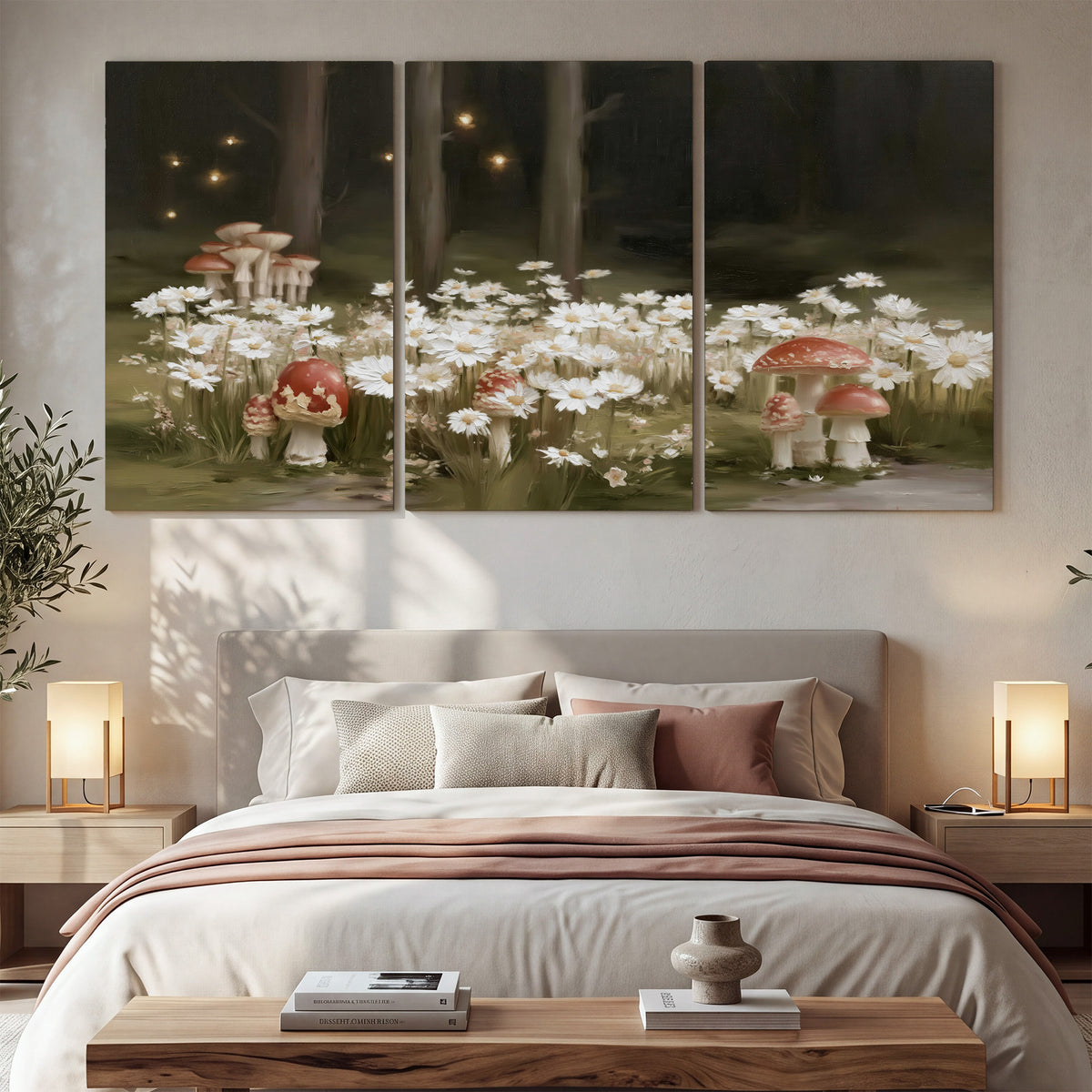 Pale daisies and red-capped mushrooms in a dark meadow with tiny painted points of light 3 piece canvas wall art displayed in a bedroom