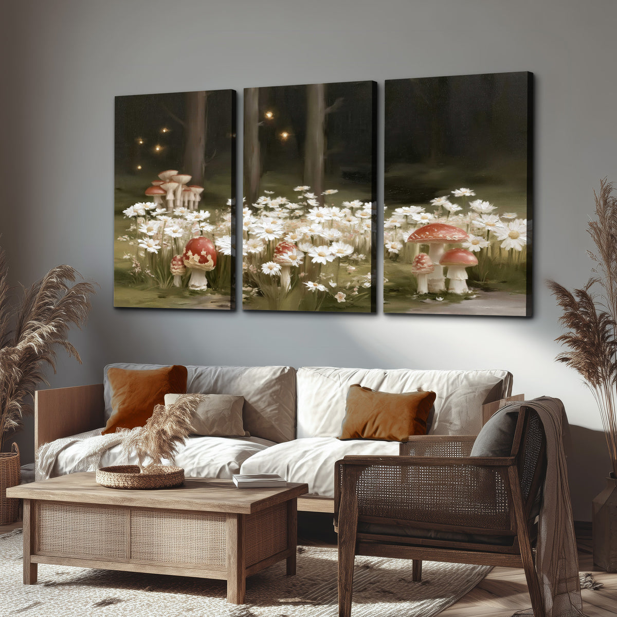 Pale daisies and red-capped mushrooms in a dark meadow with tiny painted points of light 3 piece canvas wall art displayed in a rustic living room