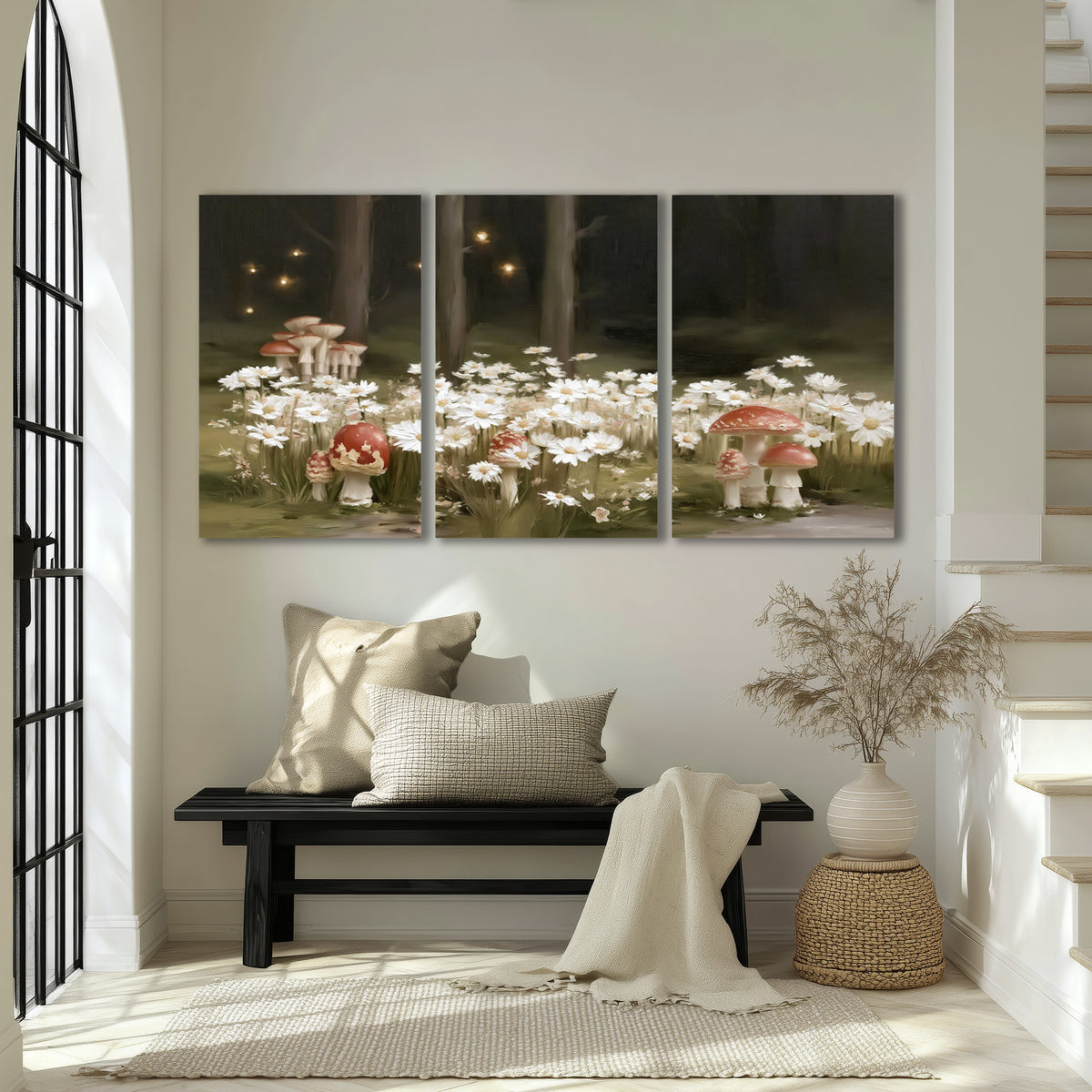 Pale daisies and red-capped mushrooms in a dark meadow with tiny painted points of light 3 piece canvas wall art displayed in a entryway