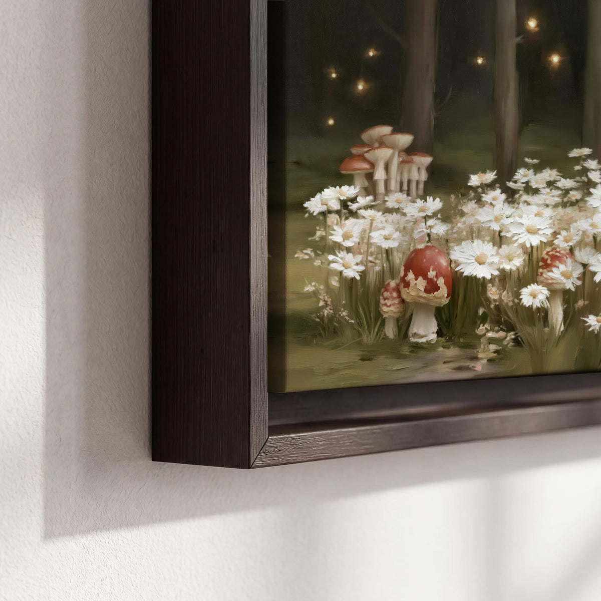 Pale daisies and red-capped mushrooms in a dark meadow with tiny painted points of light 3 piece framed canvas wall art material and edge close up