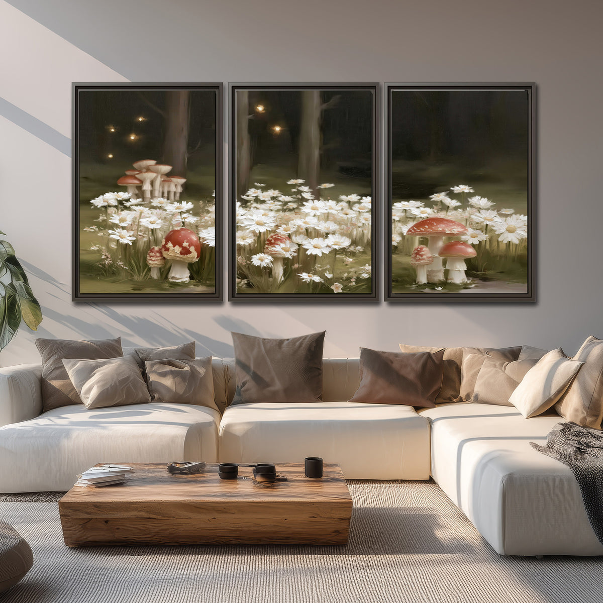 Pale daisies and red-capped mushrooms in a dark meadow with tiny painted points of light 3 piece framed canvas wall art displayed in a living room