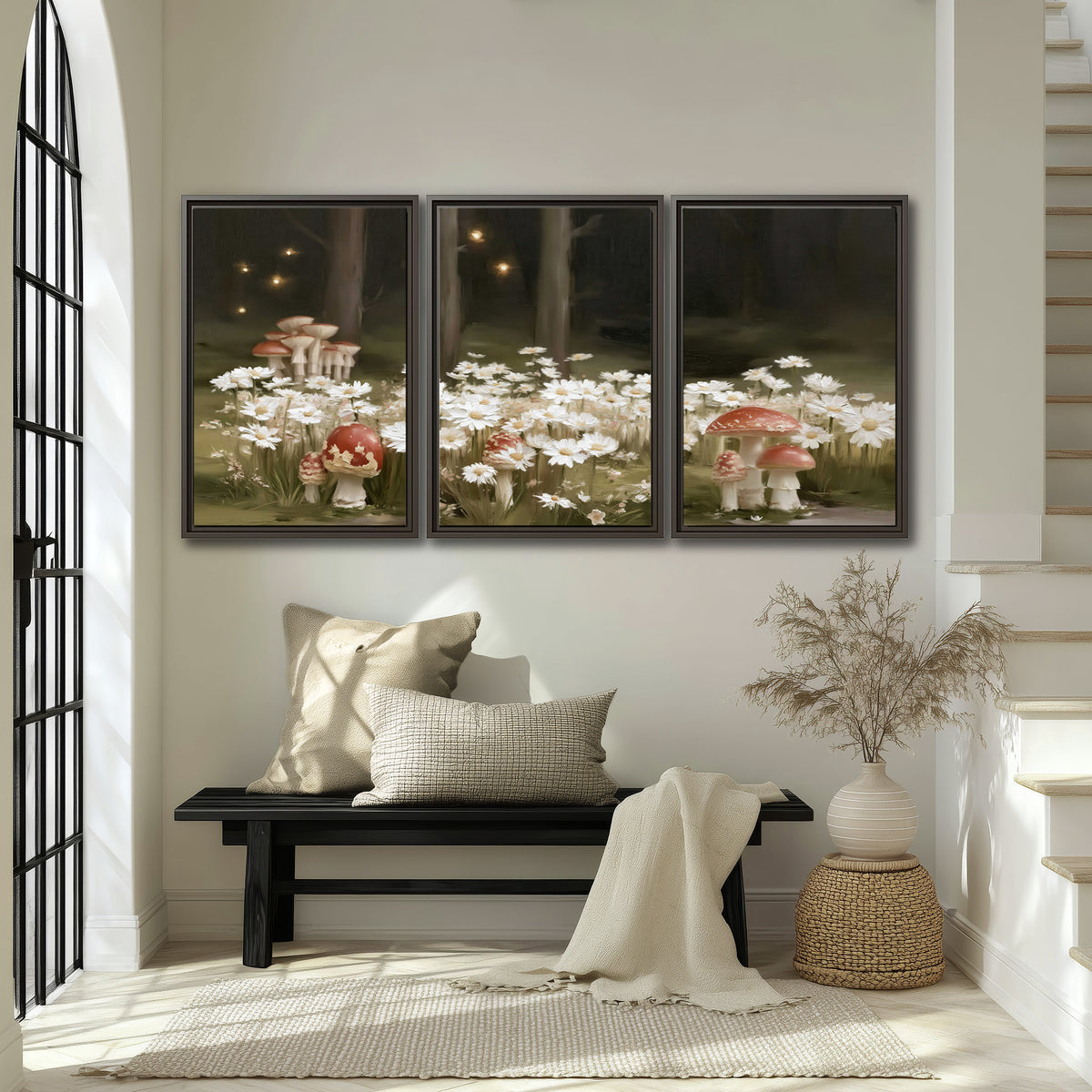 Pale daisies and red-capped mushrooms in a dark meadow with tiny painted points of light 3 piece framed canvas wall art displayed in a entryway