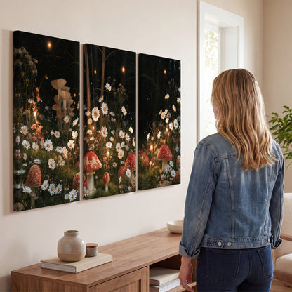 Red mushrooms and delicate white flowers glowing in a painted nighttime woodland scene 3 piece canvas wall art three panel arrangement on a wall