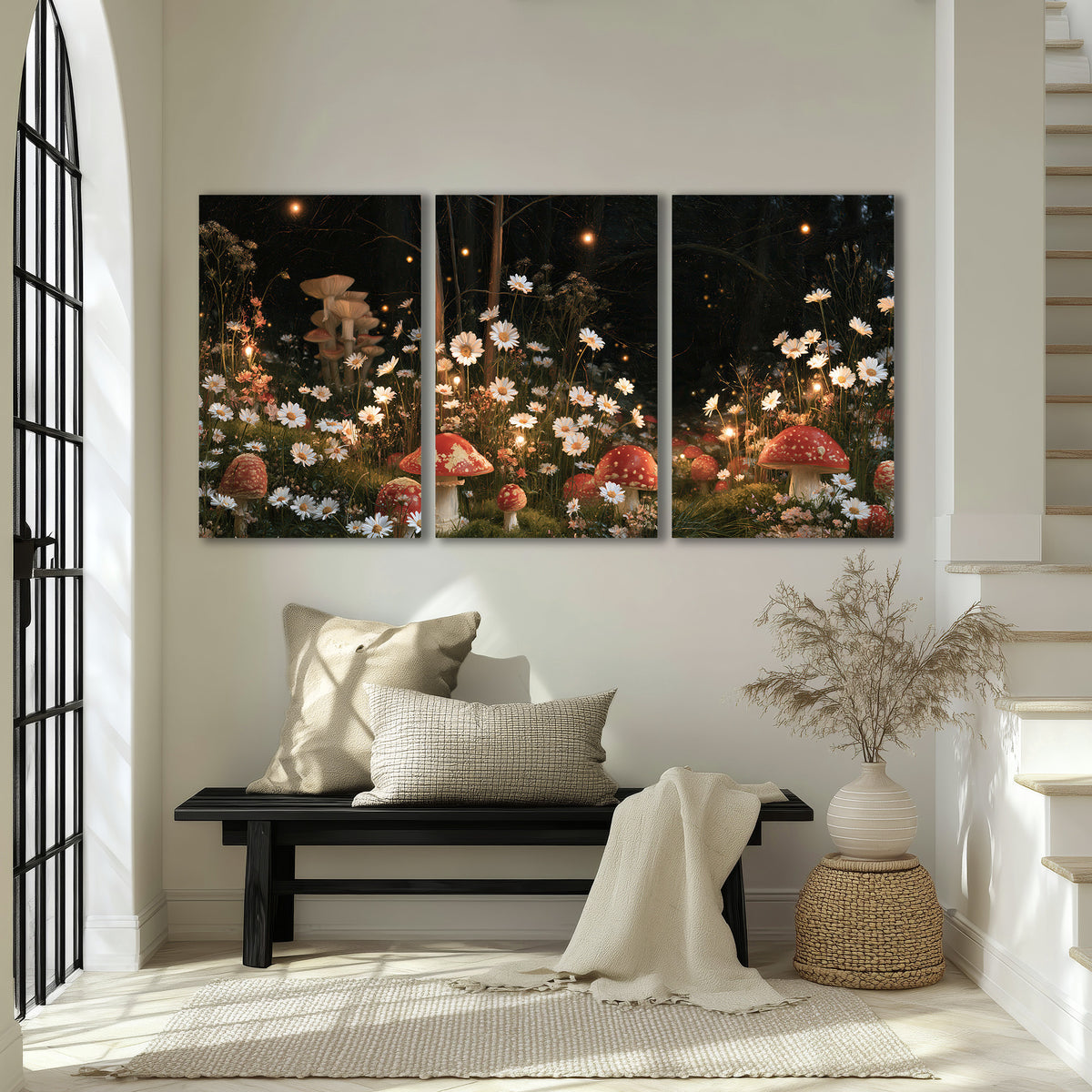 Red mushrooms and delicate white flowers glowing in a painted nighttime woodland scene 3 piece canvas wall art displayed in a entryway