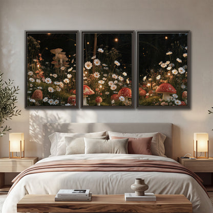 Red mushrooms and delicate white flowers glowing in a painted nighttime woodland scene 3 piece framed canvas wall art displayed in a bedroom