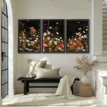 Red mushrooms and delicate white flowers glowing in a painted nighttime woodland scene 3 piece framed canvas wall art displayed in a entryway