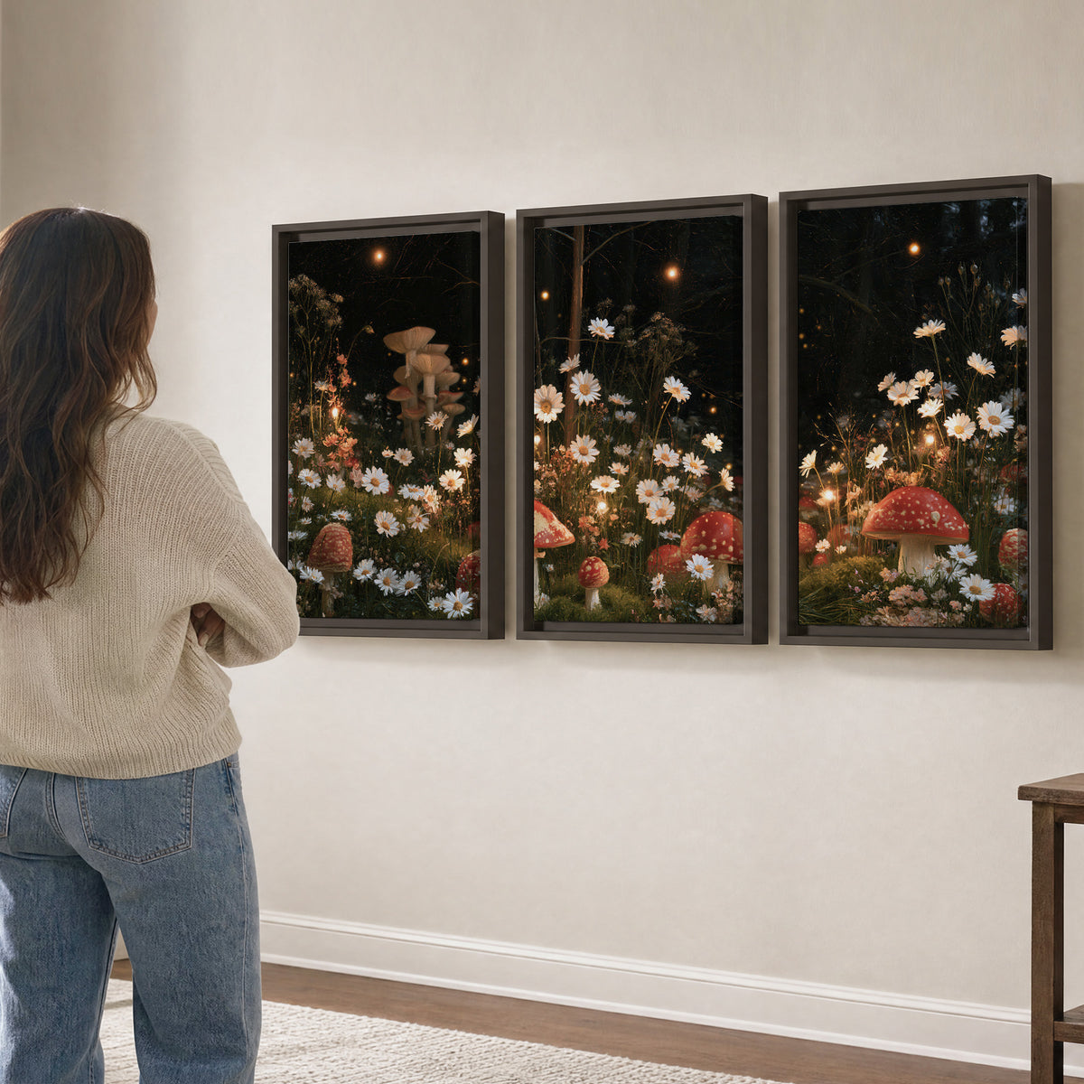 Red mushrooms and delicate white flowers glowing in a painted nighttime woodland scene 3 piece framed canvas wall art three panel arrangement on a wall