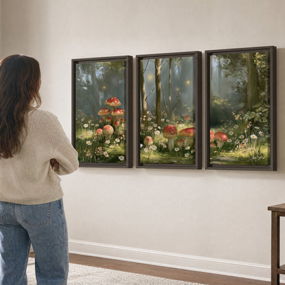 Red-capped mushrooms and white flowers beside tall trees in a sunlit forest 3 piece framed canvas wall art three panel arrangement on a wall