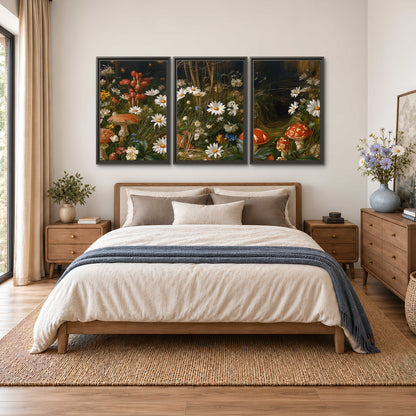 White daisies and warm red mushrooms scattered across a dark woodland garden 3 piece framed canvas wall art styled in an interior