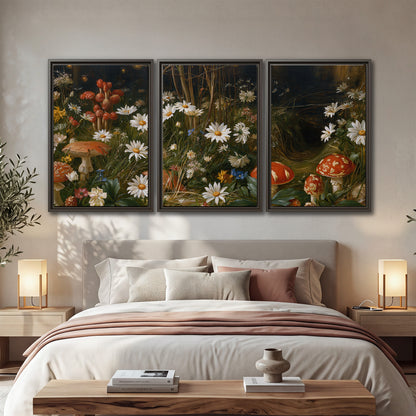 White daisies and warm red mushrooms scattered across a dark woodland garden 3 piece framed canvas wall art displayed in a bedroom