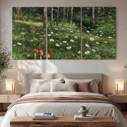 A green woodland floor covered with small white daisies and red mushroom accents 3 piece canvas wall art displayed in a bedroom