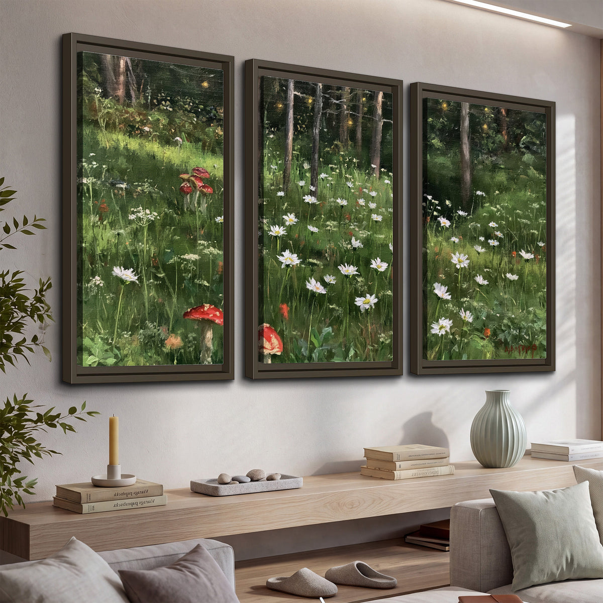A green woodland floor covered with small white daisies and red mushroom accents 3 piece framed canvas wall art displayed in a console