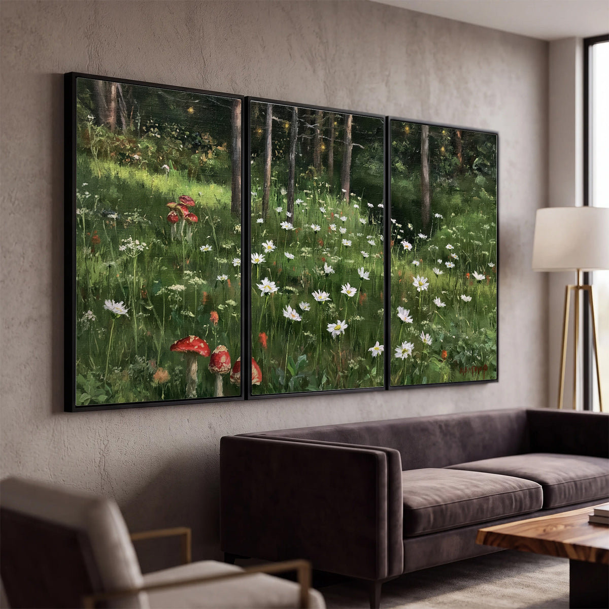 A green woodland floor covered with small white daisies and red mushroom accents 3 piece framed canvas wall art displayed in a modern living room