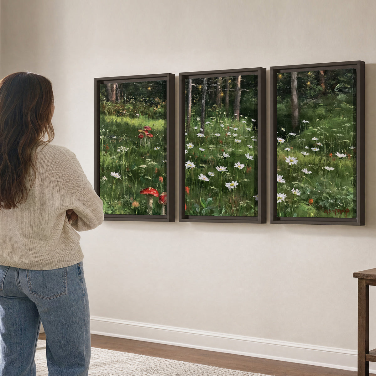 A green woodland floor covered with small white daisies and red mushroom accents 3 piece framed canvas wall art three panel arrangement on a wall