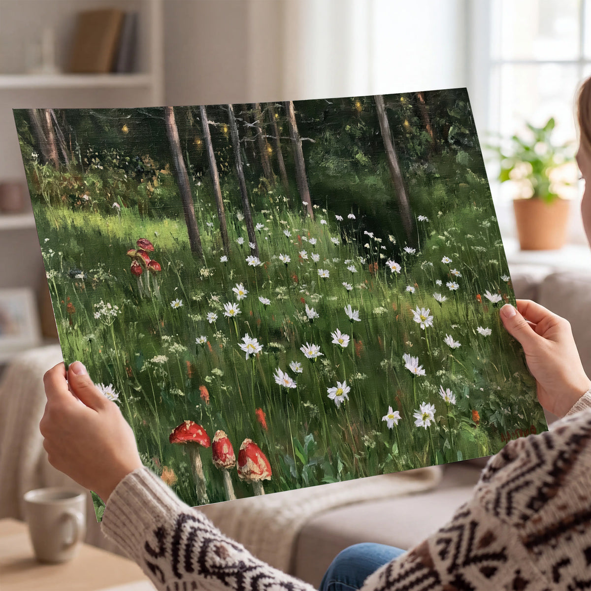 A green woodland floor covered with small white daisies and red mushroom accents single poster print held in hands