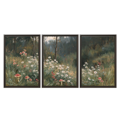 A soft woodland meadow filled with pale flowers and scattered warm red accents 3 piece framed canvas wall art viewed straight on