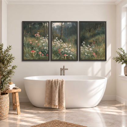 A soft woodland meadow filled with pale flowers and scattered warm red accents 3 piece framed canvas wall art styled in an interior