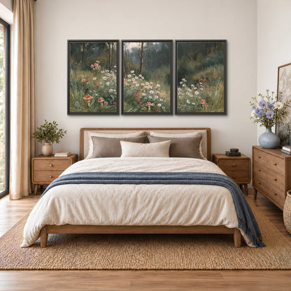 A soft woodland meadow filled with pale flowers and scattered warm red accents 3 piece framed canvas wall art styled in an interior