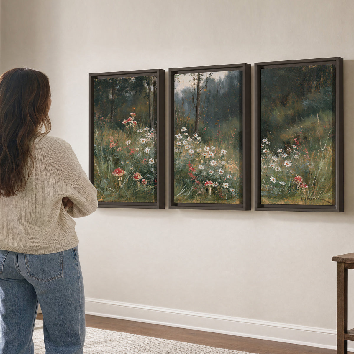 A soft woodland meadow filled with pale flowers and scattered warm red accents 3 piece framed canvas wall art three panel arrangement on a wall
